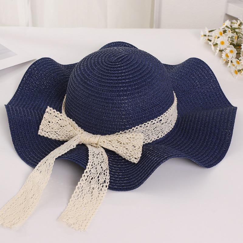 Summer wavy edge bow streamer straw hat seaside outing idyllic sunshade sun protection UV protection sun hat