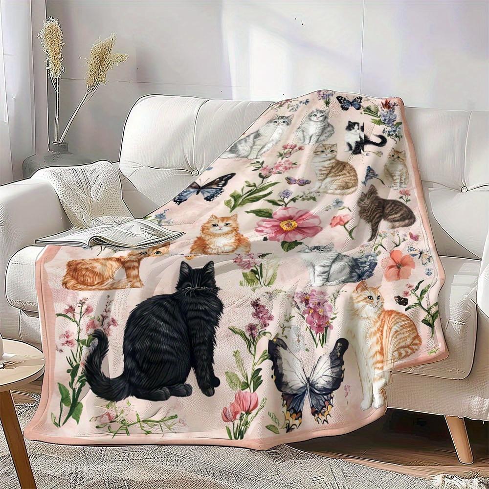 A Single Cozy And Soft Fleece Throw Blanket Featuring Adorable Cats And a Floral Pattern, Ideal for Use On a Couch, Sofa, Bed, Or In The Liv