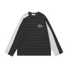 Herre løstsiddende langærmet t-shirt med uregelmæssige farveblokstriber Streetwear Afslappet top Efterår