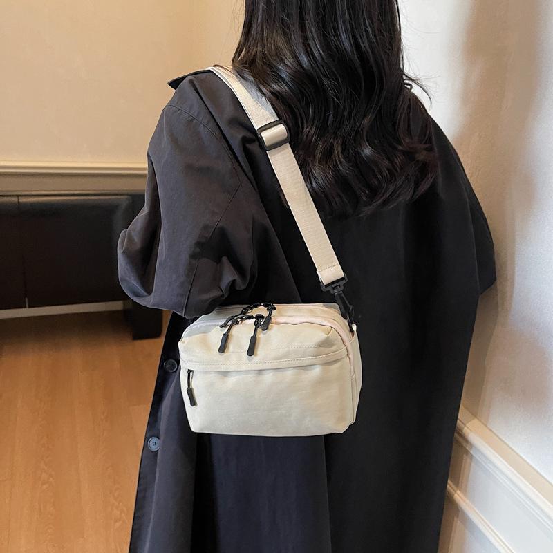 Mobile phone bag simple trend 2025 summer new Japanese lightweight shoulder small backpack women's leisure sports messenger bag