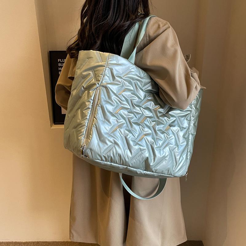 Autumn and winter new travel bag single shoulder portable large-capacity cotton clothing bag pearlescent leather film Korean version fitness bag