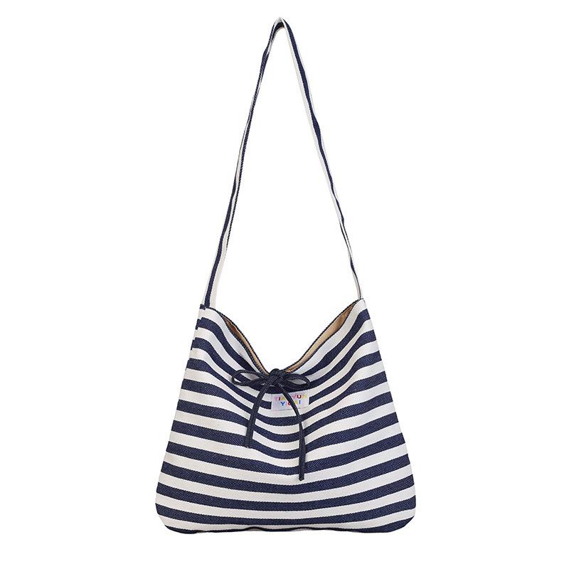 

Casual striped canvas bag women s spring and summer new largecapacity commuter shoulder messenger bag темно-синього кольору
