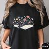 Funny Black Cat On Book With Wildflowers T Shirt Unisex