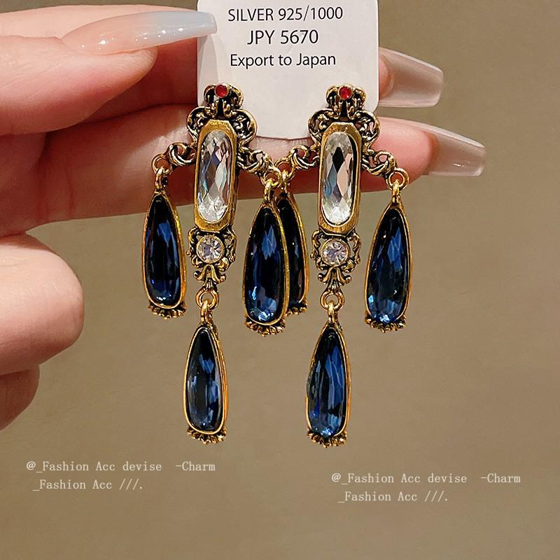 

Винтажные серьги-кисточки из серебряной иглы: Элегантный дизайн в виде капли воды с ретро-литературным оттенком