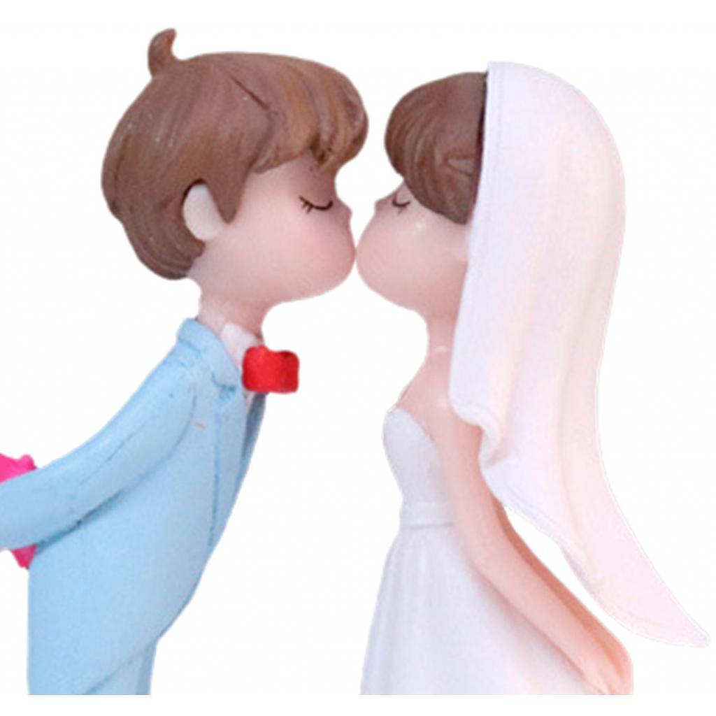 Charming Wedding Cake Topper Featuring Miniature Bride and Groom