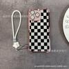 Black plaid applies to iPhone17 mobile phone case, four corners anti-drop airbag 16promax portable rope 15 protective case.