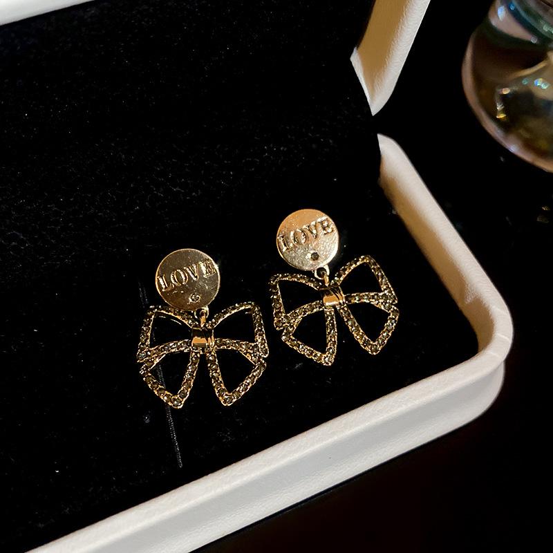Silver Needle Diamond Bow LOVE Earrings with Retro Fashion Design – Niche Light Luxury High-End Earrings