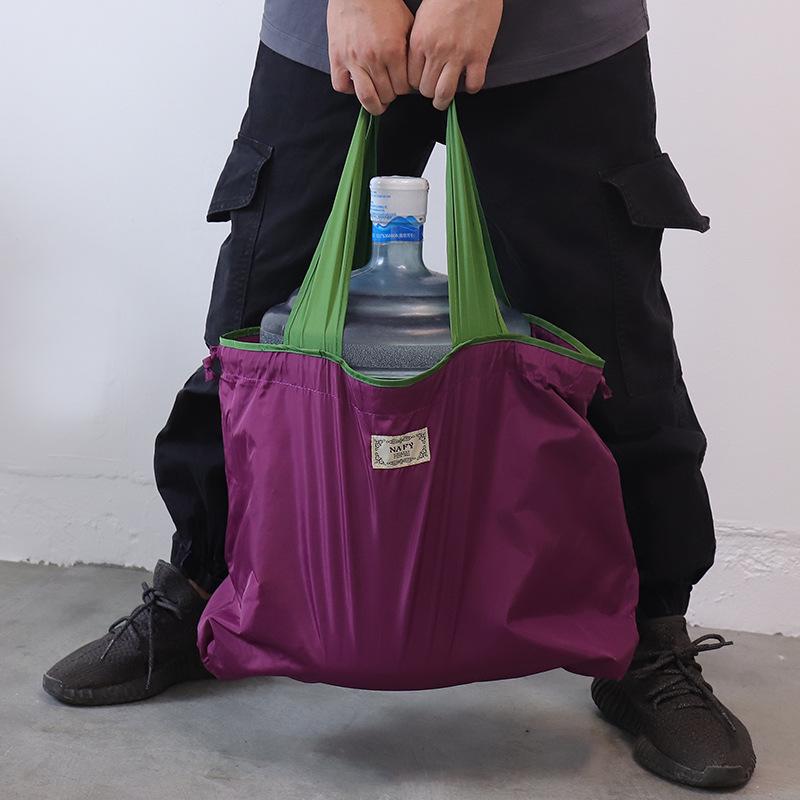 Eco-friendly Lightweight Water-repellent Foldable Shopping Bag with Drawstring Closure and Large Capacity