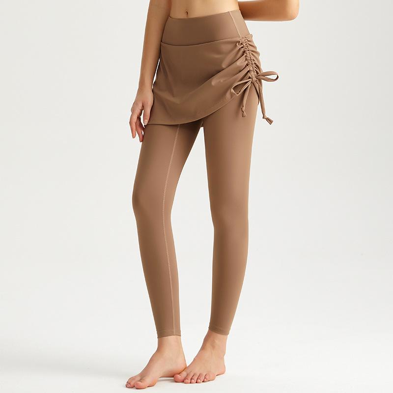 Ruffled High-Waist Yoga Pants with Skirt Overlay – Quick-Dry, Butt-Lifting, Anti-Embarrassment Design for Running, Dancing, and Sports.