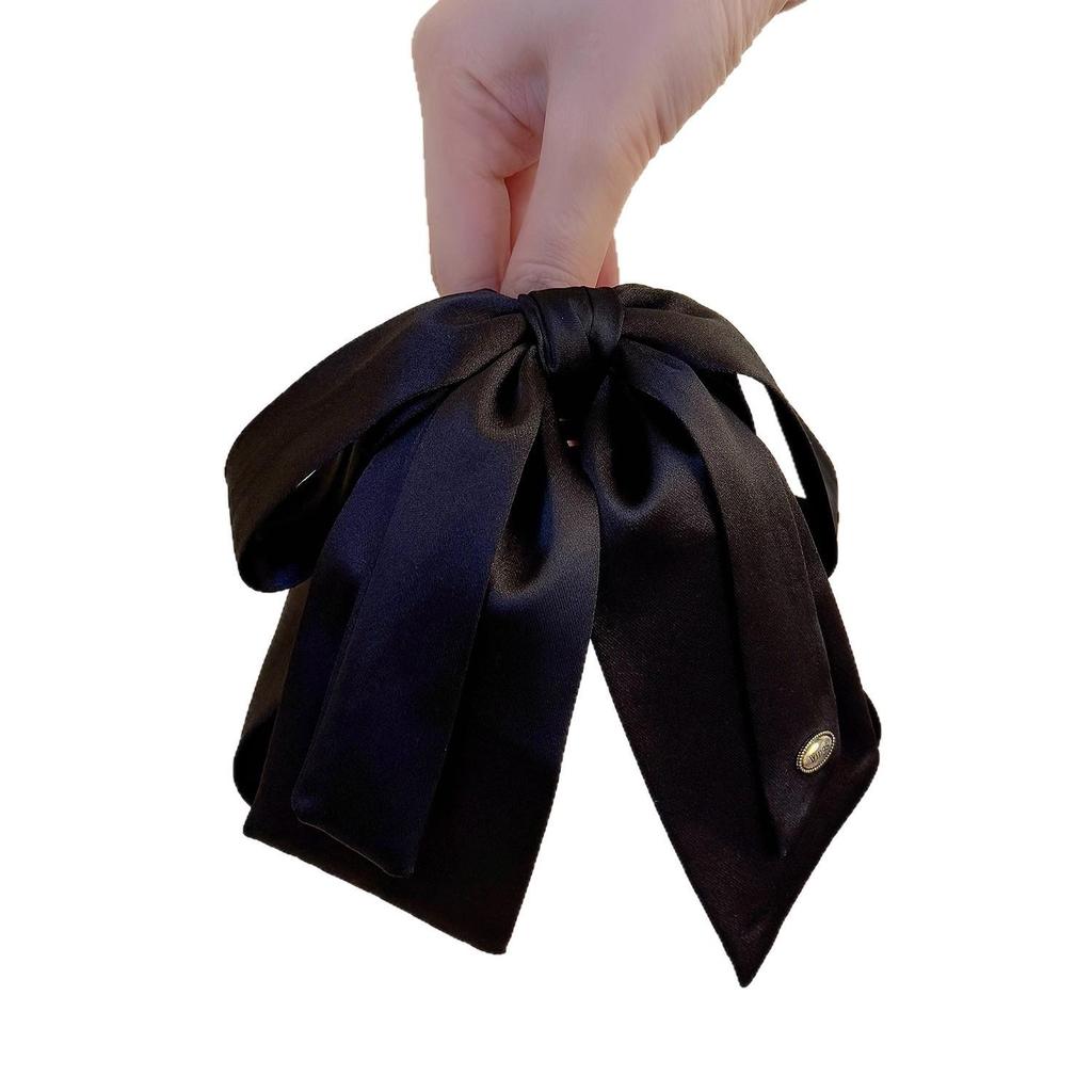 Luxuriöse Satin-Schwarze Schleife Pferdeschwanz Krallenklemme mit Goldetikett für Elegante Hochsteckfrisur