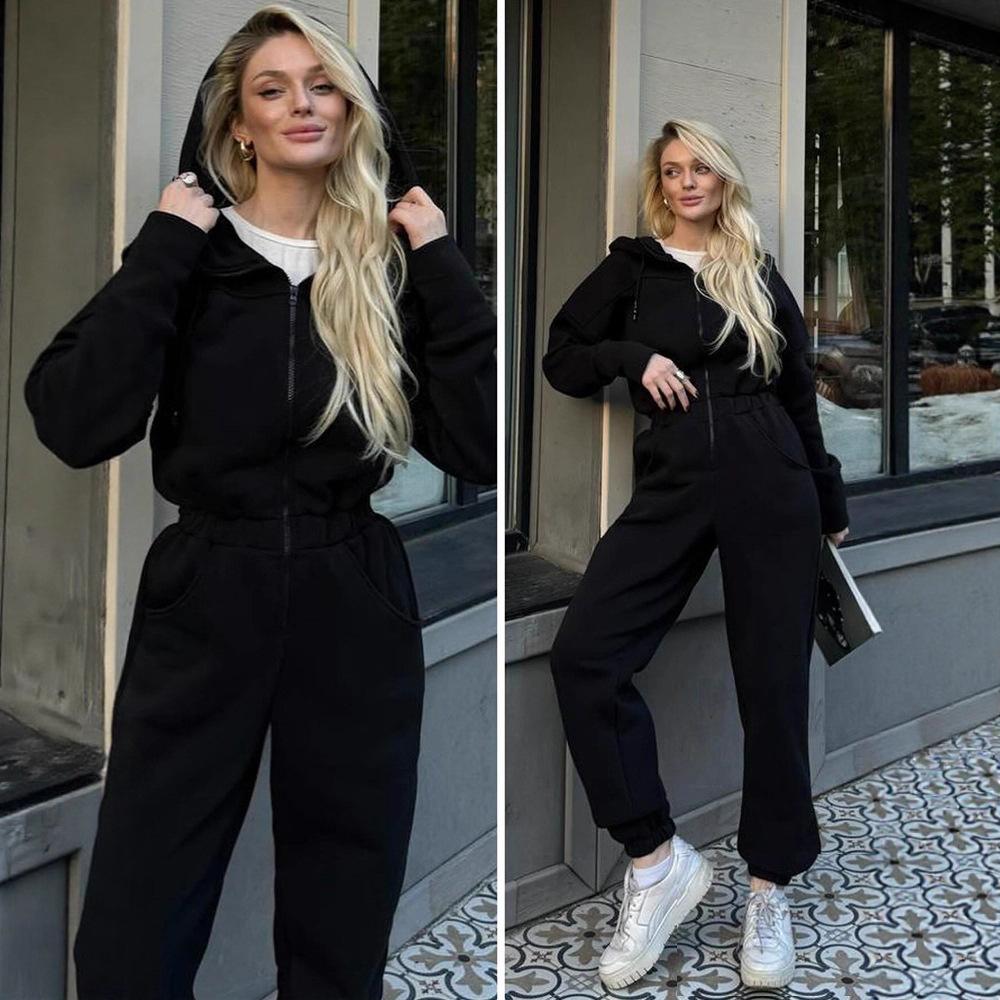 Tuta intera da donna casual europea e americana con cappuccio in vita a tinta unita a maniche lunghe con cerniera sportiva intera
