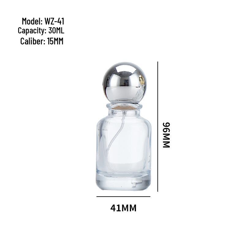 Round Glass Perfume Bottle with Wood Lid and Spray Nozzle.