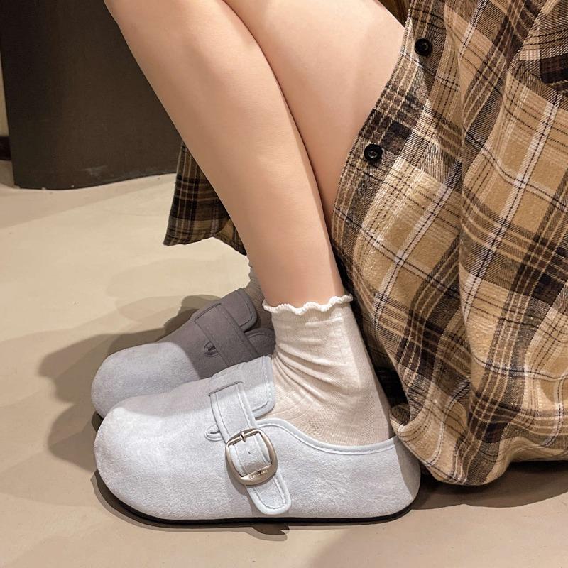 A Vintage Thick-soled Flip-flops for A Woman Cool Flip-flops and Height-increasing Shoes