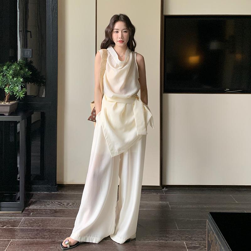 

Прохладный и расслабленный, носите полный комплект женского летнего повседневного темперамента, легкий и дышащий комплект-двойку из топа без рукавов и брюк-палаццо. XL