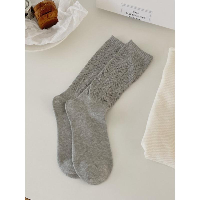 This Spring and Autumn Collection Features Solid-color Hollowed-out Mesh Pile Socks, Mid-calf Socks That Slimmer Legs, and Retro Style Socks