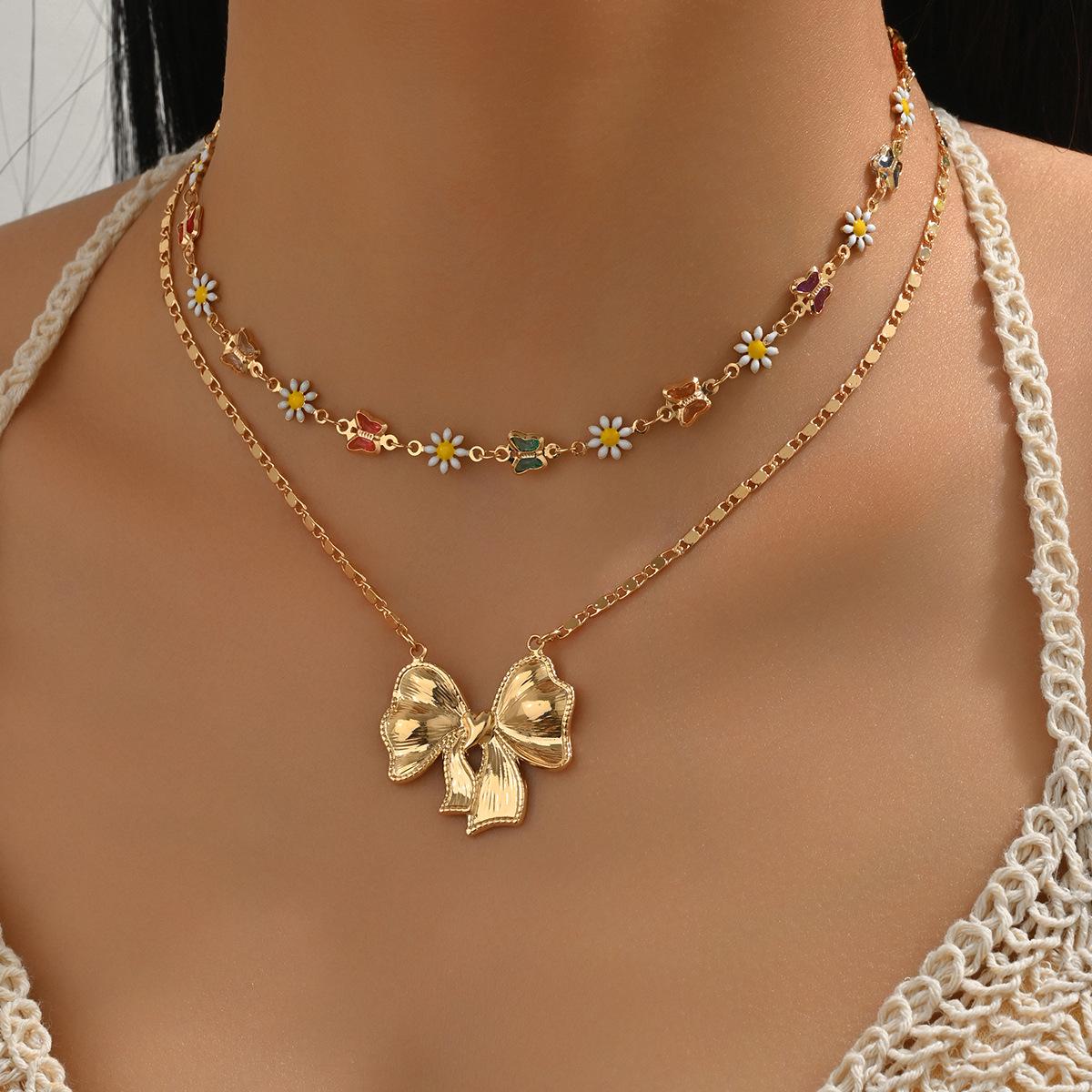

Women s Layered Necklace with 3D Bow, Colorful Butterfly, and Daisy Pendant