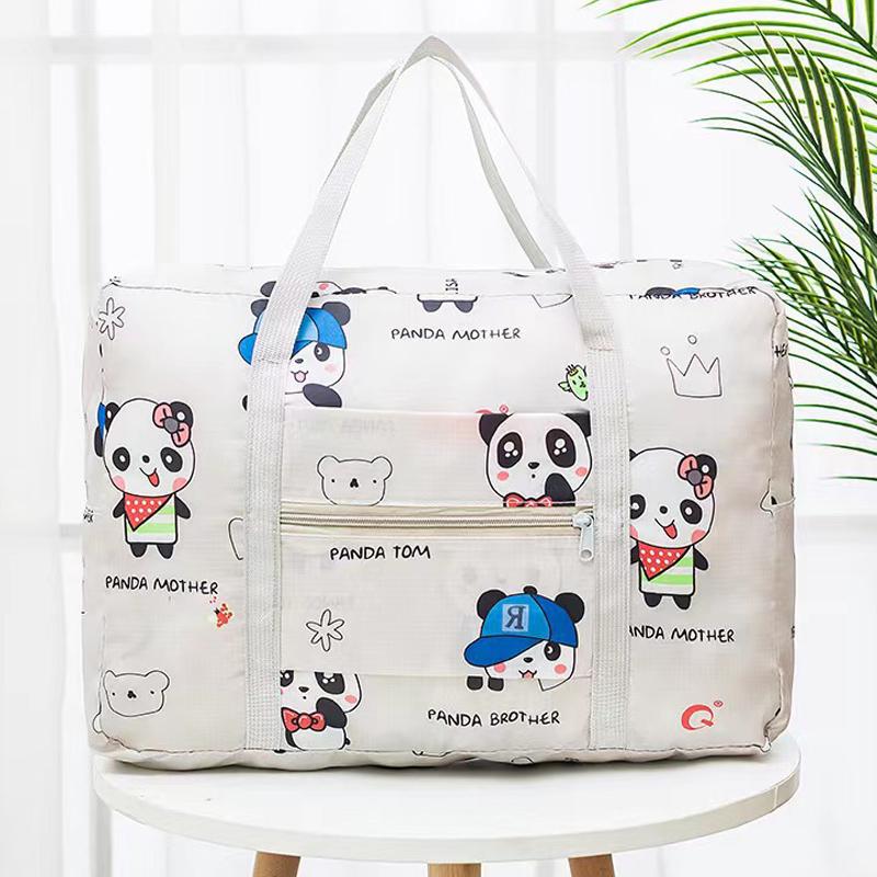 Compact travel bag: suitcase-compatible, hand-held, features an external pocket, handle slip-over design, with matching accessory bag.