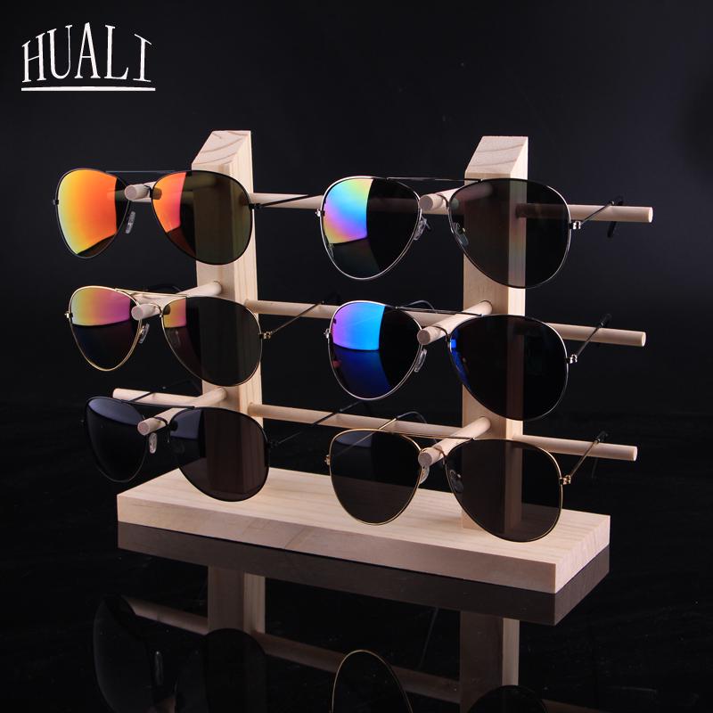 Stojak podłogowy z litego drewna na oprawki okularów i okulary przeciwsłoneczne