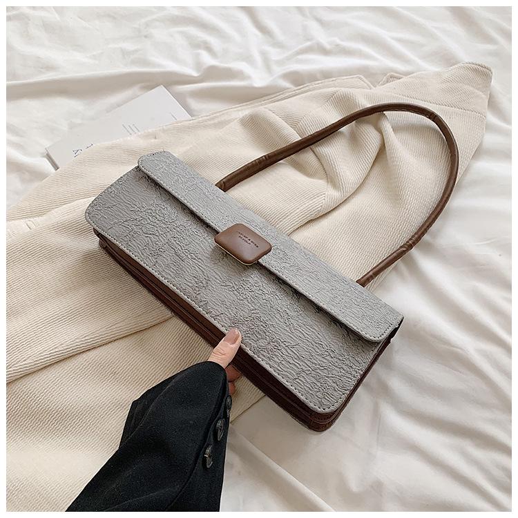 

Commuter armpit baguette bag women s large capacity 2025 new fashion niche design foreign style shoulder handbag сірий колір