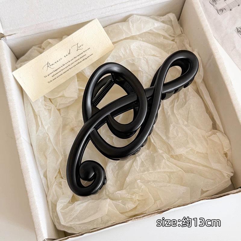 

Elegant Musical Note Shaped Hair Claw Features Fluid Sculptural Lines For Sophisticated Updos And Secure Daily Hold Matte Black Note Claw