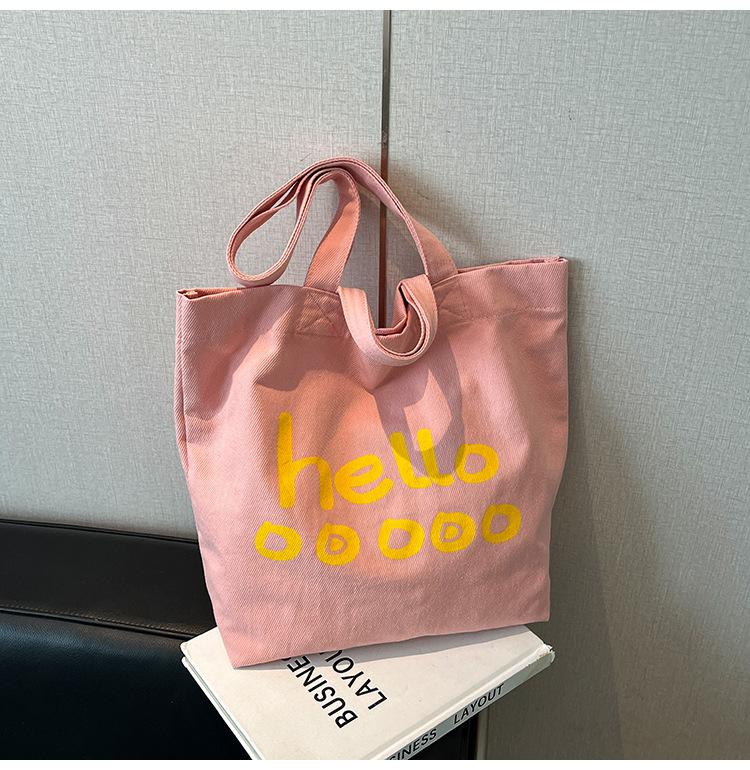 

Casual large-capacity canvas bag women s 2025 new lightweight and versatile shoulder tote bag college student class bag розовый