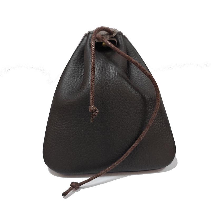 Cowhide Coin Purse: Retro Gift and Auspicious Blessing Bag for Men and Women with Creative Drawstring Design.