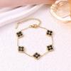 European Three-Piece Jewelry Set: Retro Black Gold Four-Leaf Clover Necklace, Earrings, and Bracelet