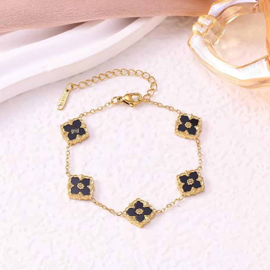 European Three-Piece Jewelry Set: Retro Black Gold Four-Leaf Clover Necklace, Earrings, and Bracelet