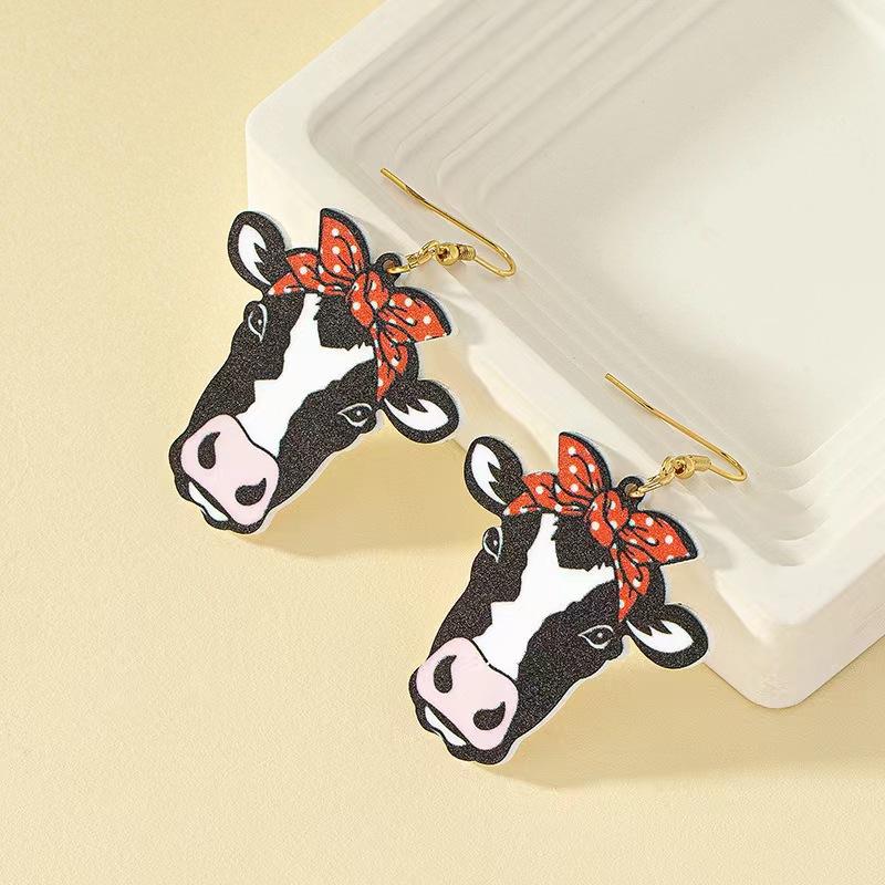 The cow wears a bow, earrings, earrings, fashionable and exquisite acrylic material, single-sided printing, sweet and cool.
