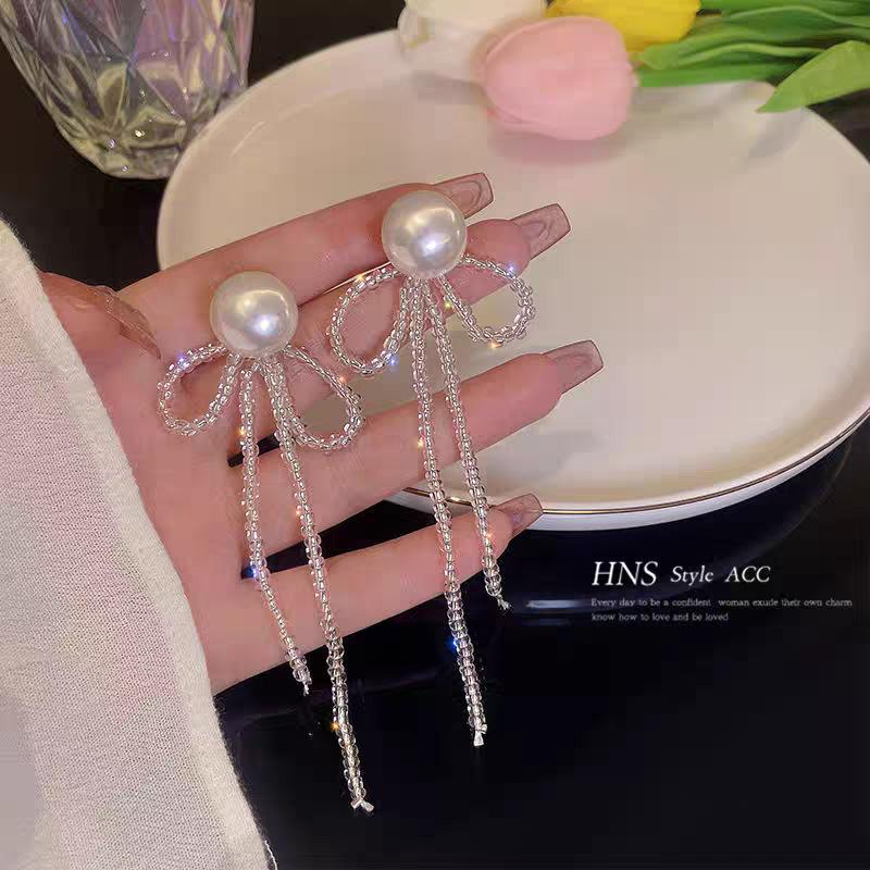 New temperament fringed bow earrings female, niche design handmade pearl Internet celebrity earrings earrings