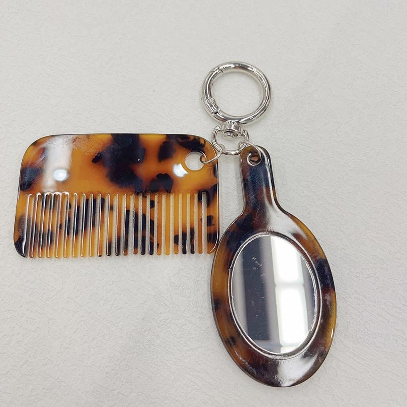 Neuankömmling Kreativer Harz-Kamm Schlüsselanhänger Essigsäure Spiegel Kammform Anhänger Schlüsselring Frauen Täglicher Gebrauch von Taschenzubehör