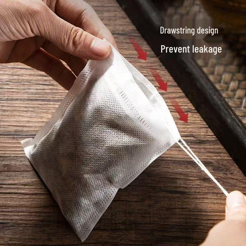 100-Piece Disposable Tea Bags: Food-Grade Non-Woven Drawstring Bags for Chinese Medicine Decoctions and Dregs Separation.