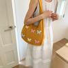 New high-end knitted bag hollow bag simple shoulder bag bow element knitted bag
