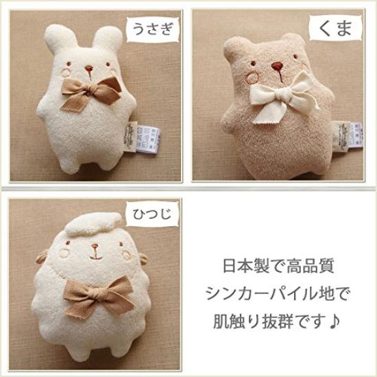 Made in Japan, cotton rattle for newborns, featuring a smiling animal with a bell inside. Amorosa Mamma brand. Perfect as a baby toy, plush toy, or