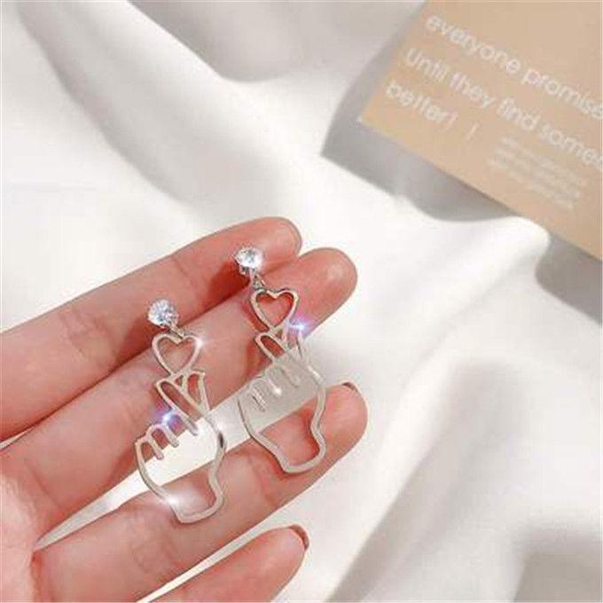 

Геометричні сережки «Котяче око» 2024: Корейська мода осінь/зима, дизайн, що робить обличчя худішим