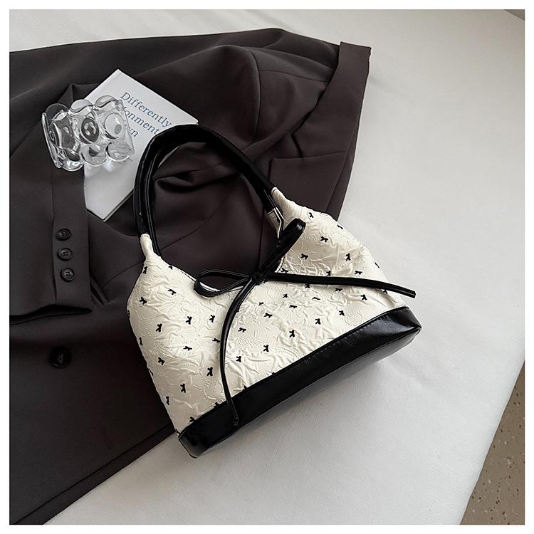 

Классическая печать премиальная текстура сумка-мессенджер 2025 новая мода универсальный нишевый дизайн портативная на плечо под мышку