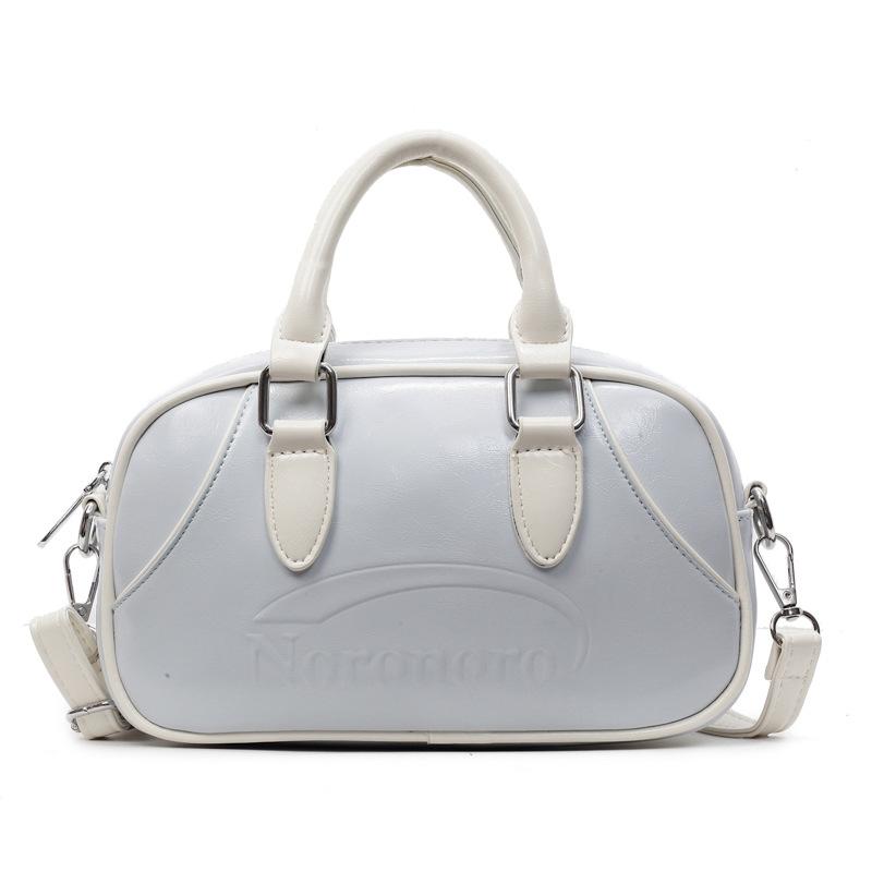 2025 new Korean simple contrasting color portable Boston bag casual commuting versatile foreign style niche messenger women's bag