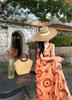 French Retro Orange V-neck Printed Suspender Dress for Women's Summer New Seaside Vacation Super Good-looking Temperament Dress