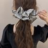 The Floral Large Intestine Hair Tie Is A Laid-back and Feminine Style with A Fabric Hair Tie for Tying Hair