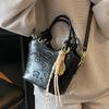 2025 new niche embossed fashion personalized portable bucket bag high-end commuter versatile women's messenger bag