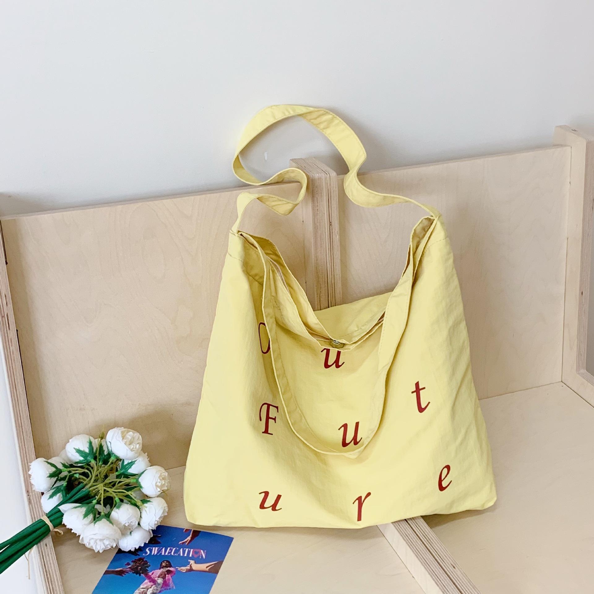 

Nylon cloth letter bag women 2025 new trend Korean version tote bag student class commuting versatile shoulder bag жёлтый