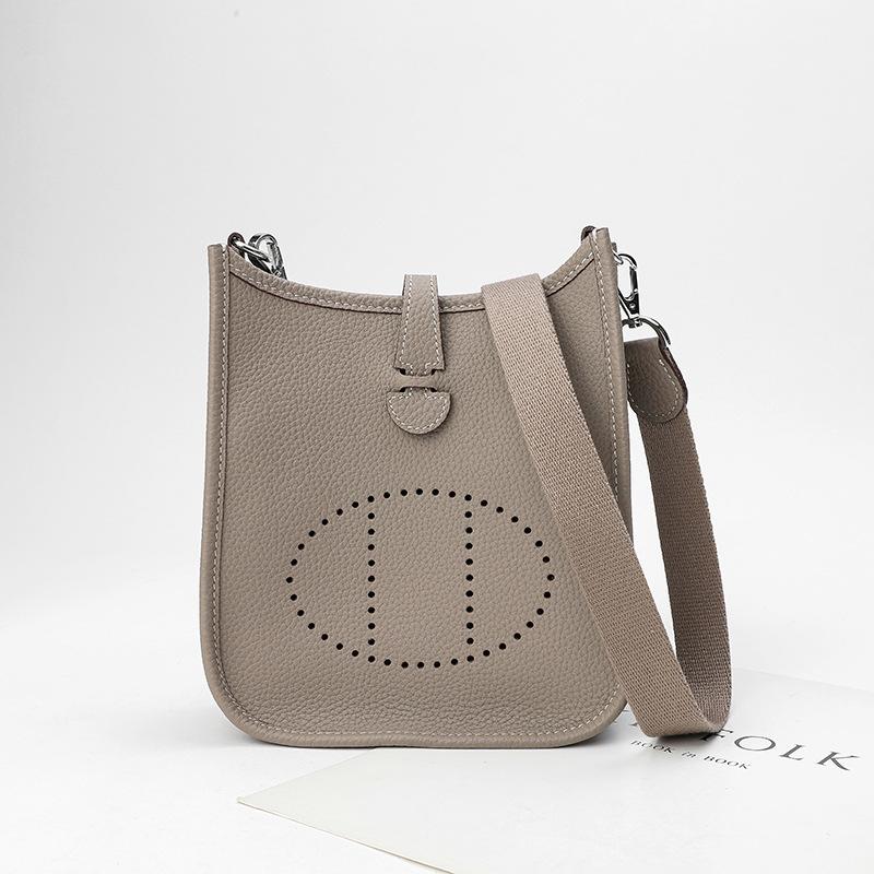 Factory wholesale first layer togo cowhide bucket bag women's bag lychee pattern hollow single shoulder crossbody bag hollow design