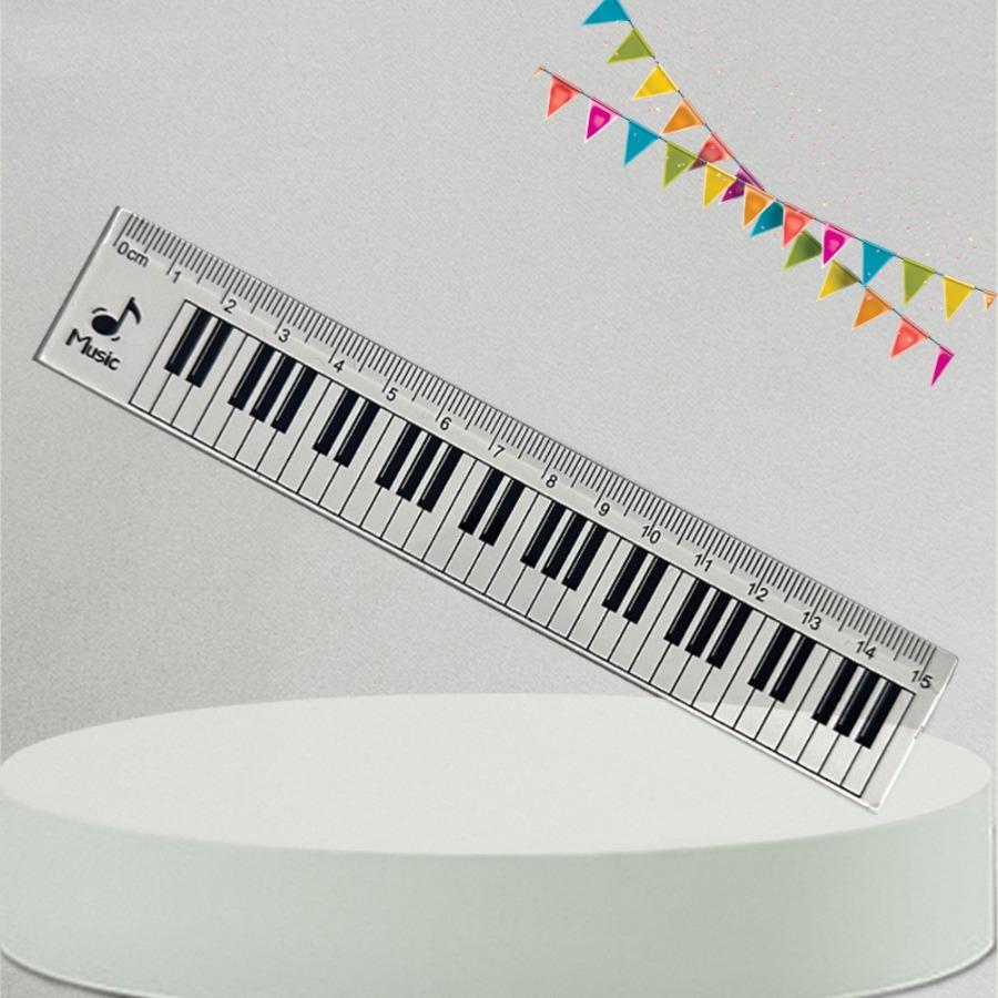 A Ruler for Music Enthusiasts, a Piano Keyboard, And a Tool for Measuring Musical Staff