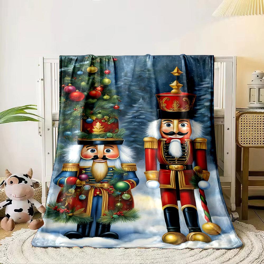 Two Festive Nutcracker Figures, One In Red and One In Blue, In Snowy Scenery. for All Seasons Blanket Lunch Break Throw Gift