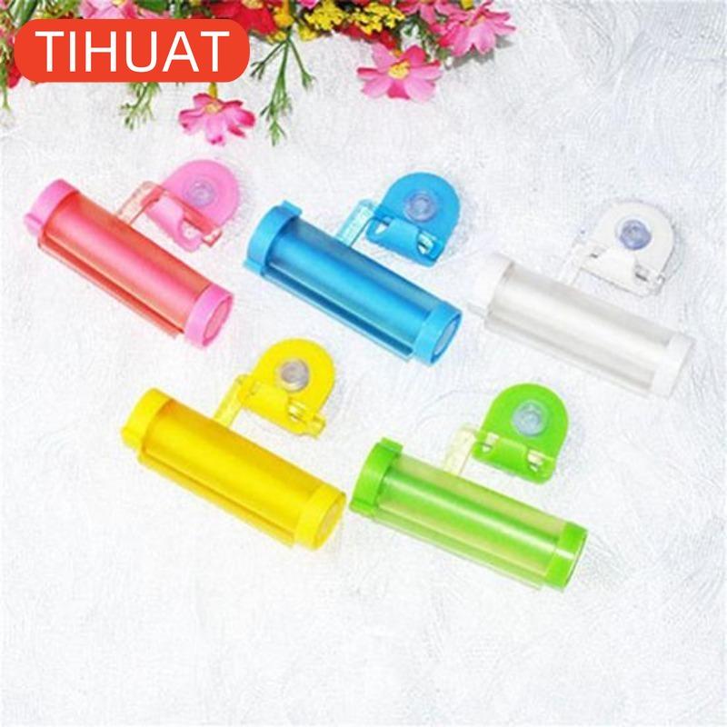 Plastic Device - A Suction Cup Press for Convenient Storage and Uniform Squeezing of Toothpaste Tubes
