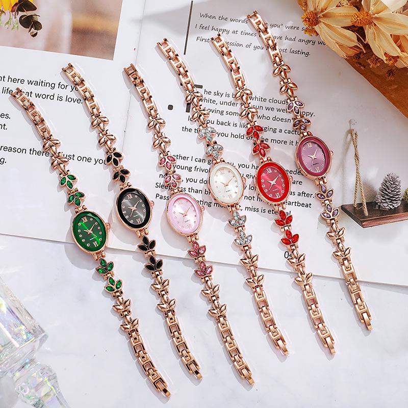 Luxury Rhinestone Women's Wristwatch with Round Dial and Colored Diamond Bracelet.