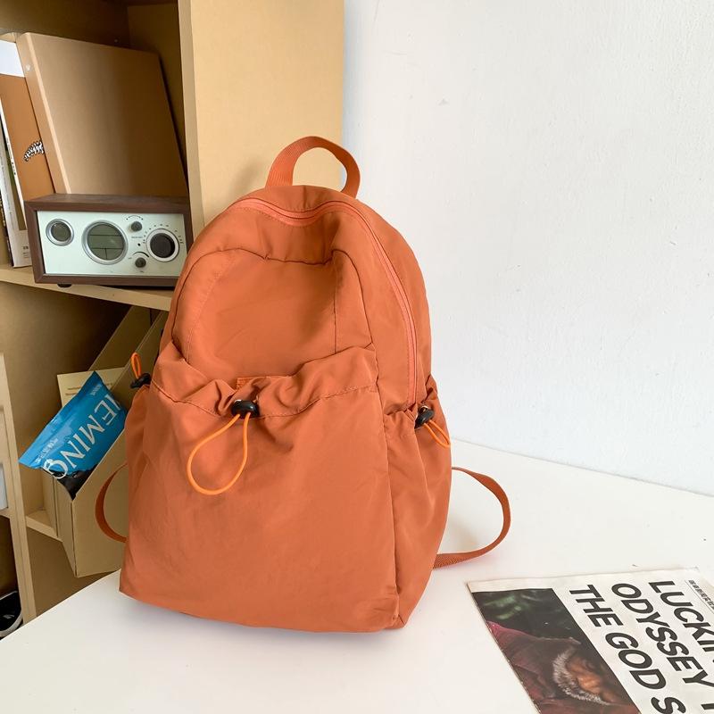 

Japanese solid color pleated nylon backpack men s large-capacity lightweight leisure travel backpack women s college student computer bag