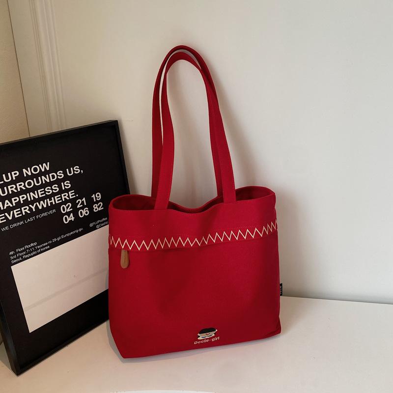 

2025 осень новая мода простая большая вместимость сумка через плечо нишевый дизайн однотонная японская холщовая сумка-тоут бордовый