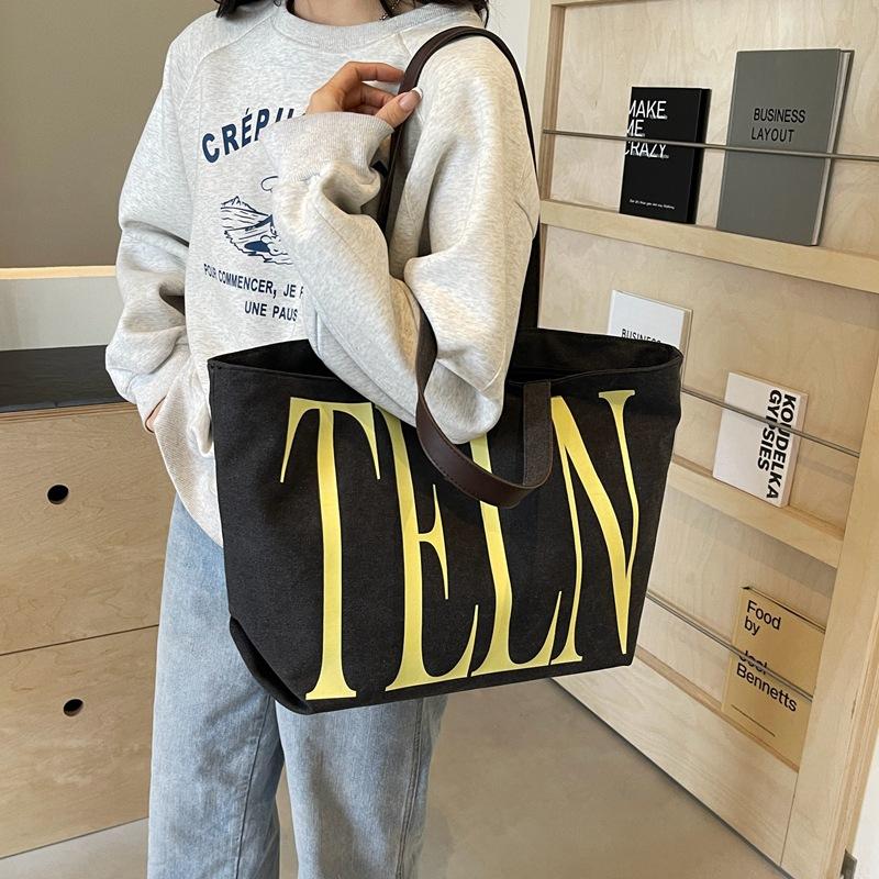 Fashion Korean version ins niche letter printed canvas bag 2025 new casual mommy shopping bag shoulder bag