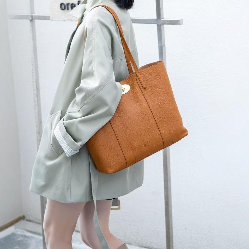 The first layer cowhide women's bag, the new simple and versatile commuter large-capacity tote bag, portable shoulder bag.